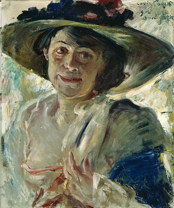 Woman in a hat with roses