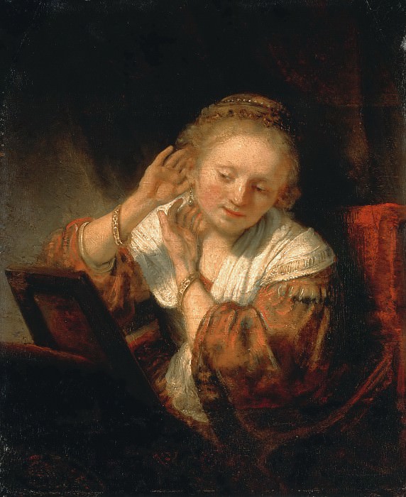 Молодая женщина, примеряющая серьги, Рембрандт Харменс ван Рейн
