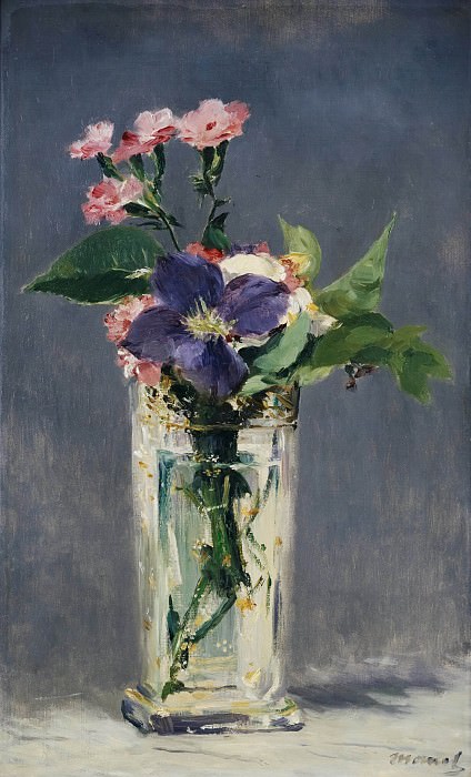 Carnations and clematis in a crystal vase