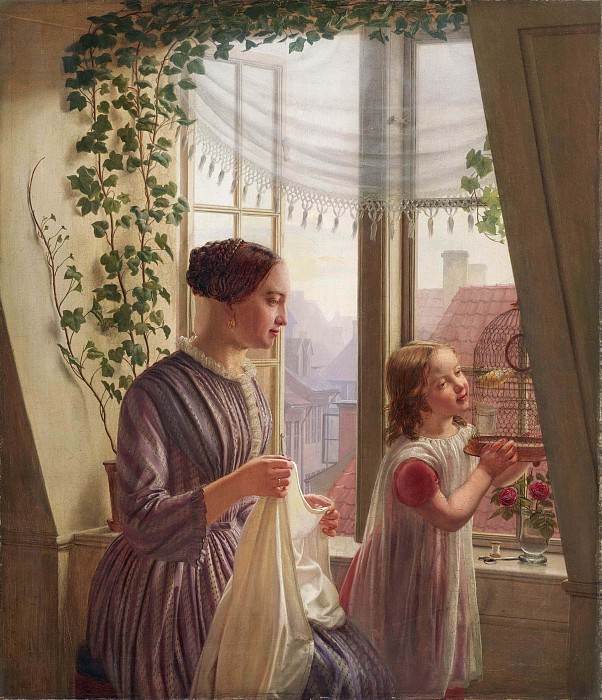 Interior of mother and daughter at the window